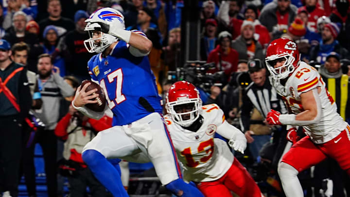 Bills quarterback Josh Allen avoids Kansas City's Nazeeh Johnson and Drue Tranquill on his late fourth-quarter touchdown. Bills quarterback Josh Allen avoids Kansas City's Nazeeh Johnson and Drue Tranquill on his late fourth-quarter touchdown.