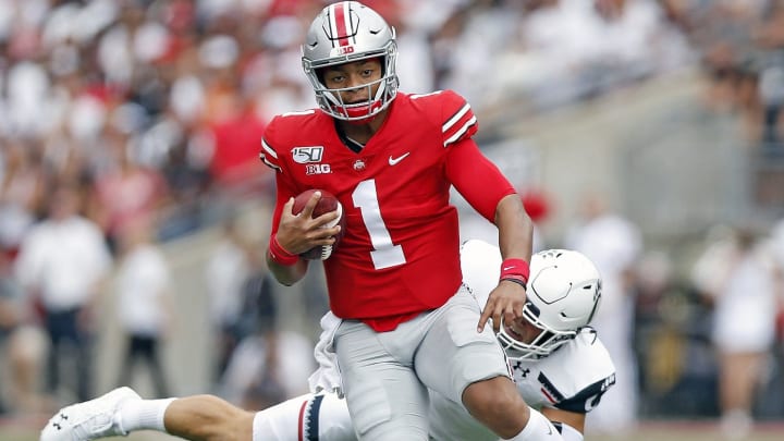 Ohio State Buckeyes quarterback Justin Fields (1) shakes off Cincinnati Bearcats linebacker Joel Dublanko (41) during the 1st quarter of their game at Ohio Stadium on September 7, 2019. Ohio State Buckeyes quarterback Justin Fields (1) shakes off Cincinnati Bearcats linebacker Joel Dublanko (41) during the 1st quarter of their game at Ohio Stadium on September 7, 2019.
