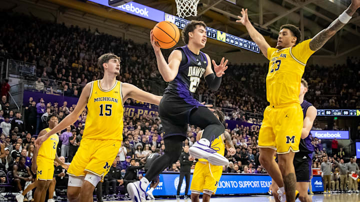 JJ Mandaquit tries to penetrate Michigan's defense. 