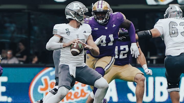 Deshawn Lynch bears down on the Eastern Michigan quarterback.