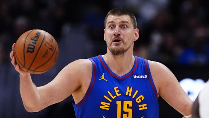 Feb 9, 2026; Denver, Colorado, USA; Denver Nuggets center Nikola Jokic (15) reacts in the second quarter against the Cleveland Cavaliers at Ball Arena. Mandatory Credit: Ron Chenoy-Imagn Images
