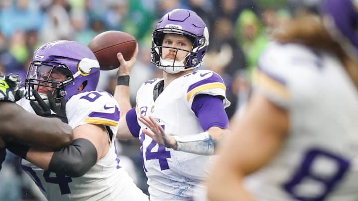 Dec 22, 2024; Seattle, Washington, USA; Minnesota Vikings quarterback Sam Darnold (14) passes against the Seattle Seahawks during the first quarter at Lumen Field. Mandatory Credit: Joe Nicholson-Imagn Images