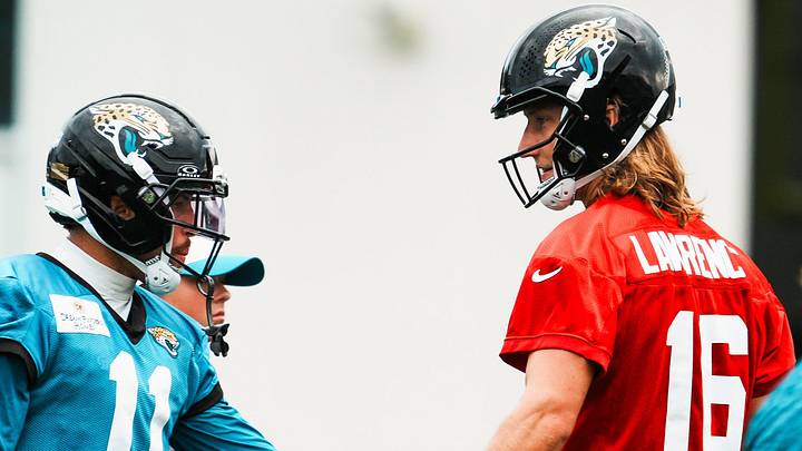 Jacksonville Jaguars wide receiver Parker Washington (11) gets a high-five from Jacksonville Jaguars quarterback Trevor Lawrence (16) during a joint Buccaneers‑Jaguars NFL practice Wednesday, August 26, 2026 at the Miller Electric Center in Jacksonville, Fla. [Doug Engle/Florida Times-Union]