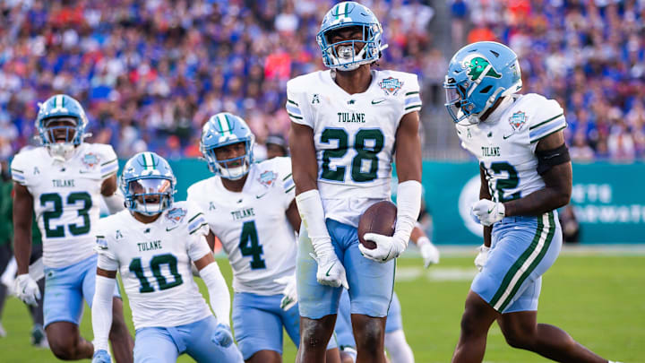 Tulane Green Wave linebacker Dickson Agu (28) celebrates after intercepting the ball during the first half at Raymond James Stadium in Tampa, FL on Friday, December 20, 2024 in the 2024 Union Home Mortgage Gasparilla Bowl Tulane Green Wave linebacker Dickson Agu (28) celebrates after intercepting the ball during the first half at Raymond James Stadium in Tampa, FL on Friday, December 20, 2024 in the 2024 Union Home Mortgage Gasparilla Bowl