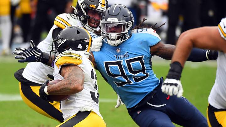 Oct 25, 2020; Nashville, Tennessee, USA; Tennessee Titans outside linebacker Jadeveon Clowney (99) tackles Pittsburgh Steelers running back James Conner (30) at Nissan Stadium. Mandatory Credit: Christopher Hanewinckel-Imagn Images Oct 25, 2020; Nashville, Tennessee, USA; Tennessee Titans outside linebacker Jadeveon Clowney (99) tackles Pittsburgh Steelers running back James Conner (30) at Nissan Stadium. Mandatory Credit: Christopher Hanewinckel-Imagn Images