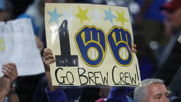 Sep 24, 2026; Philadelphia, Pennsylvania, USA; A fan holds a Milwaukee Brewers 100 win sign after a win against the Philadelphia Phillies at Citizens Bank Park. Mandatory Credit: Bill Streicher-Imagn Images Sep 24, 2026; Philadelphia, Pennsylvania, USA; A fan holds a Milwaukee Brewers 100 win sign after a win against the Philadelphia Phillies at Citizens Bank Park. Mandatory Credit: Bill Streicher-Imagn Images