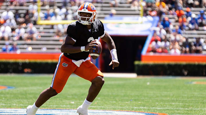 Florida Gators quarterback DJ Lagway (2) scrambles with the ball during the first half at the Orange and Blue spring football game at Steve Spurrier Field at Ben Hill Griffin Stadium in Gainesville, FL on Saturday, April 13, 2024. [Matt Pendleton/Gainesville Sun]