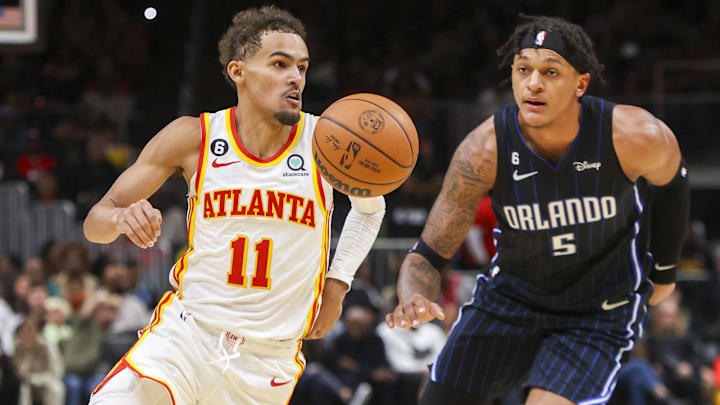 Oct 21, 2022; Atlanta, Georgia, USA; Atlanta Hawks guard Trae Young (11) dribbles past Orlando Magic forward Paolo Banchero (5) in the second half at State Farm Arena. Mandatory Credit: Brett Davis-Imagn Images

