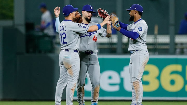 Aug 19, 2025; Denver, Colorado, USA; Los Angeles Dodgers left fielder Alex Call (12) and center fielder Andy Pages (44) and right fielder Teoscar Hernandez (37) celebrate after the game against the Colorado Rockies at Coors Field. Mandatory Credit: Isaiah J. Downing-Imagn Images