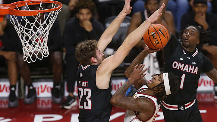 Iowa State Cyclones guard Keshon Gilbert (10) shoots the ball between Omaha Mavericks forward Joshua Streit (23) and guard JJ White (1) during the first half in the NCAA men’s basketball at Hilton Coliseum on Sunday, Dec. 15, 2024, in Ames, Iowa.