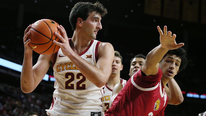 Iowa State Cyclones forward Milan Momcilovic (22) looks for pass as IU Indianapolis Jaguars forward DeSean Goode (2) defends during the second half in the NCAA men’s basketball at Hilton Coliseum on Monday, Nov. 18, 2024, in Ames, Iowa.
