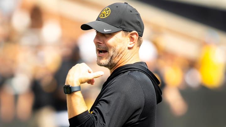Aug 9, 2025; Iowa offensive coordinator and quarterbacks coach Tim Lester talks with players during the Hawkeyes Kids Day NCAA football open practice at Kinnick Stadium in Iowa City, Iowa. Mandatory Credit: Joseph Cress for the Des Moines Register