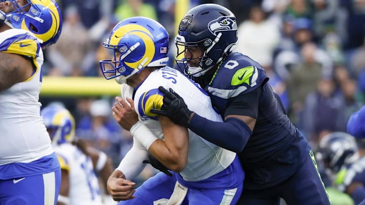 Seattle Seahawks linebacker Tyrel Dodson (0) pressures Los Angeles Rams quarterback Matthew Stafford (9) during the third quarter at Lumen Field.