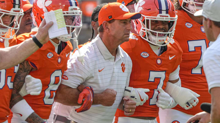 Sep 20, 2025; Clemson, South Carolina, USA; Clemson Tigers head coach Dabo Swinney joins in the Walk of Champions march after pregame practice before their game against the Syracuse Orange in Memorial Stadium. Mandatory Credit: Ken  Ruinard/GREENVILLE NEWS-USA TODAY Network via Imagn Images
