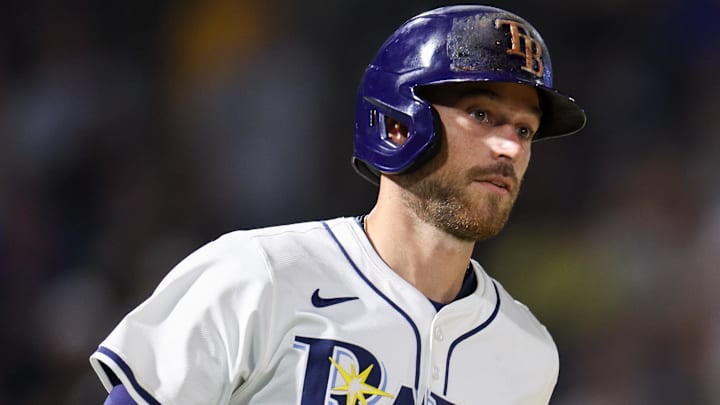 Apr 1, 2025; St. Petersburg, Florida, USA; Tampa Bay Rays second baseman Brandon Lowe (8) hits a two-run home run against the Pittsburgh Pirates in the fourth inning at George M. Steinbrenner Field.