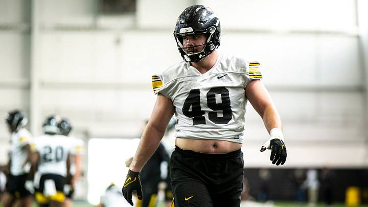 Iowa defensive lineman Ethan Hurkett (49) runs a drill during a spring NCAA football practice, Thursday, March 30, 2023, at the University of Iowa Indoor Practice Facility in Iowa City, Iowa.

230330 Iowa Spring Fb 056 Jpg