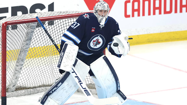 Apr 21, 2025; Winnipeg, Manitoba, CAN; Winnipeg Jets goaltender Connor Hellebuyck (37) warms up before a game against the St. Louis Blues in game two of the first round of the 2025 Stanley Cup Playoffs at Canada Life Centre. Mandatory Credit: James Carey Lauder-Imagn Images