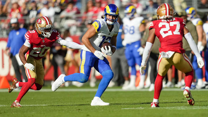 Nov 9, 2025; Santa Clara, California, USA; Los Angeles Rams wide receiver Puka Nacua (12) runs with the ball past San Francisco 49ers cornerback Upton Stout (20) during the second quarter at Levi's Stadium. Mandatory Credit: Cary Edmondson-Imagn Images