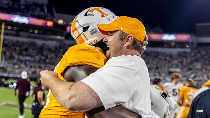Sep 27, 2025; Starkville, Mississippi, USA; Tennessee Volunteers head coach Josh Heupel and defensive lineman Caleb Herring (31) celebrate after winning the game against the Mississippi State Bulldogs at Davis Wade Stadium at Scott Field. Mandatory Credit: Wesley Hale-Imagn Images