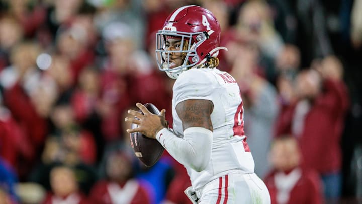 Nov 23, 2024; Norman, Oklahoma, USA; Alabama Crimson Tide quarterback Jalen Milroe (4) passes the ball during the fourth quarter against the Oklahoma Sooners at Gaylord Family-Oklahoma Memorial Stadium. Mandatory Credit: William Purnell-Imagn Images