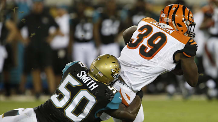 Aug 28, 2016; Jacksonville, FL, USA;  Cincinnati Bengals running back Tra Carson (39) is tackled by Jacksonville Jaguars outside linebacker Telvin Smith (50) during the second quarter of a football game at EverBank Field. Mandatory Credit: Reinhold Matay-Imagn Images