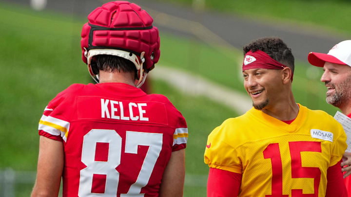 Jul 22, 2025; St. Joseph, MO, USA; Kansas City Chiefs quarterback Patrick Mahomes (15) laughs with tight end Travis Kelce (87) during training camp at Missouri Western State University. Mandatory Credit: Denny Medley-Imagn Images