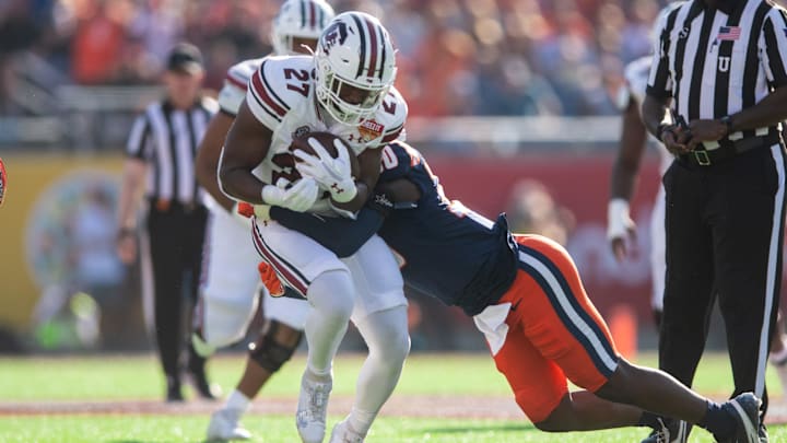 Dec 31, 2024; Orlando, FL, USA; South Carolina Gamecocks running back Oscar Adaway III (27) runs the ball against Illinois Fighting Illini linebacker Jojo Hayden (30) in the first quarter at Camping World Stadium. Mandatory Credit: Jeremy Reper-Imagn Images Dec 31, 2024; Orlando, FL, USA; South Carolina Gamecocks running back Oscar Adaway III (27) runs the ball against Illinois Fighting Illini linebacker Jojo Hayden (30) in the first quarter at Camping World Stadium. Mandatory Credit: Jeremy Reper-Imagn Images