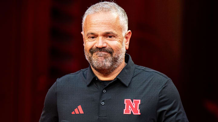 Aug 28, 2025; Kansas City, Missouri, USA; Nebraska Cornhuskers head coach Matt Rhule walks onto the field during warmups before the game against the Cincinnati Bearcats at GEHA Field at Arrowhead Stadium. Mandatory Credit: Dylan Widger-Imagn Images