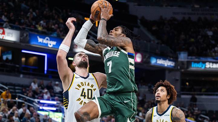 Oct 16, 2026; Indianapolis, Indiana, USA;  Milwaukee Bucks guard Kevin Porter Jr. (7) shoots the ball while Indiana Pacers center Ivica Zubac (40) defends in the first half at Gainbridge Fieldhouse.  Mandatory Credit: Trevor Ruszkowski-Imagn Images
