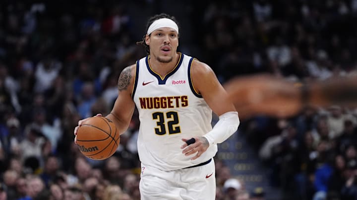 Nov 5, 2025; Denver, Colorado, USA; Denver Nuggets forward Aaron Gordon (32) dribbles the ball in the second quarter against the Miami Heat at Ball Arena. Mandatory Credit: Ron Chenoy-Imagn Images