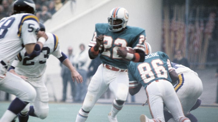 Miami Dolphins running back Mercury Morris (22) carries the ball against the Minnesota Vikings during Super Bowl VIII at Rice Stadium.