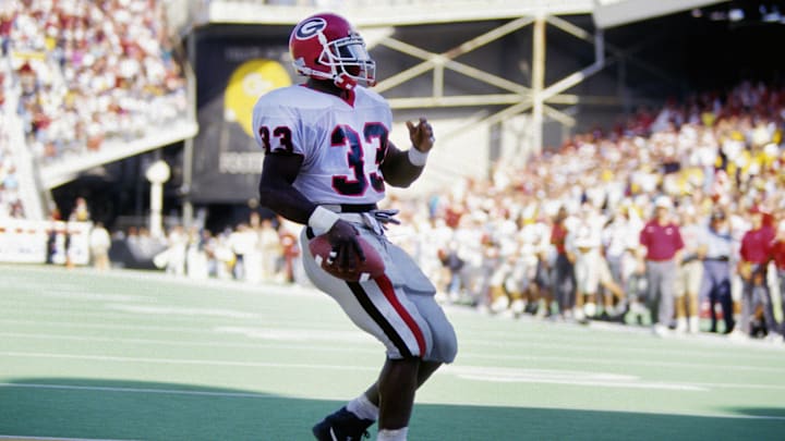 Nov 25, 1993; Atlanta, GA, USA; FILE PHOTO; Georgia Bulldogs running back Terrell Davis (33) in the end zone against the Georgia Tech Yellow Jackets at Bobby Dodd Stadium. Mandatory Credit: RVR Photos-Imagn Images 