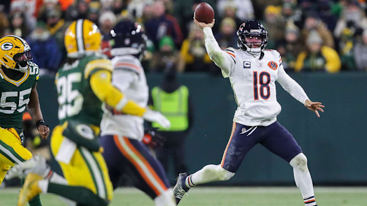 Caleb Williams rolls left and throws in Sunday's 28-21 loss at Lambeau Field. Caleb Williams rolls left and throws in Sunday's 28-21 loss at Lambeau Field.