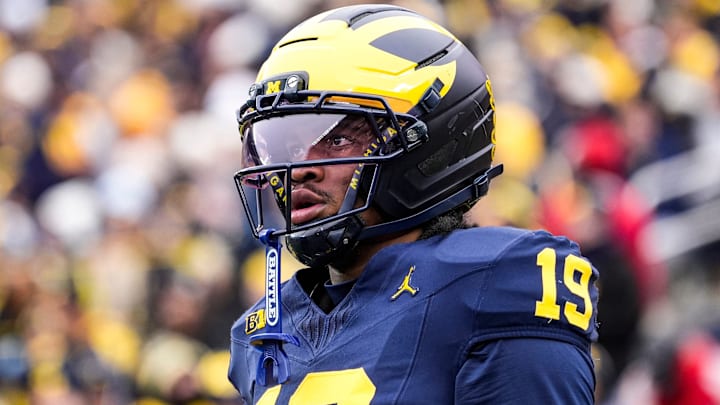 Michigan quarterback Bryce Underwood (19) looks on during warmup at Michigan Stadium in Ann Arbor on Saturday, Nov. 29, 2025.