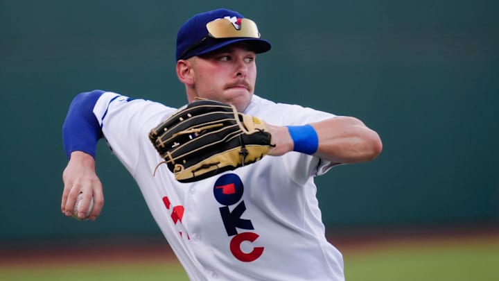 Oklahoma City's Dalton Rushing (21) throws to second during a baseball game between the Oklahoma City Baseball Club and the Round Rock Express at the Chickasaw Bricktown Ballpark in Oklahoma City, Wednesday, Aug. 7, 2024.
