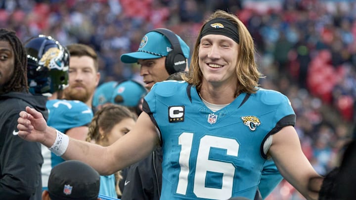 Oct 20, 2024; London, United Kingdom; Jacksonville Jaguars quarterback Trevor Lawrence (16) smiles with teammates in the second half during an NFL International Series game at Wembley Stadium. Mandatory Credit: Peter van den Berg-Imagn Images
