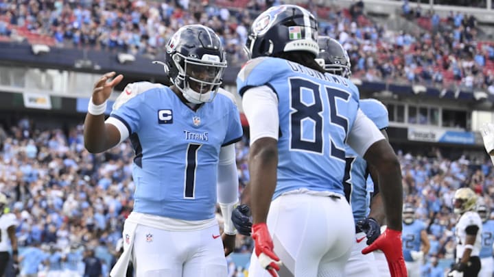 Tennessee Titans tight end Chig Okonkwo (85) celebrates with Tennessee Titans quarterback Cam Ward (1)