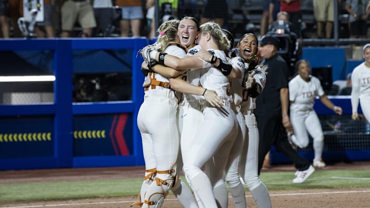 Jun 6, 2025; Oklahoma City, OK, USA;  Texas Longhorns pitcher Teagan Kavan (17) is hugged by utility Reese Atwood (14) and infielder Joley Mitchell (9) and utility Mia Scott (10) celebrating their win over the Texas Tech Red Raiders 10-4 to win the National Championship in game three of the NCAA Softball Women's College World Series finals at Devon Park. Mandatory Credit: Brett Rojo-Imagn Images