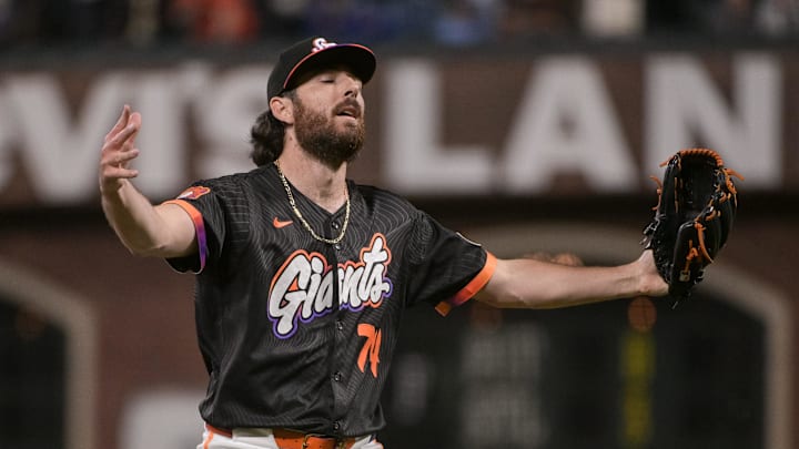 Aug 26, 2025; San Francisco, California, USA;  San Francisco Giants pitcher Ryan Walker (74) celebrates after defeating the Chicago Cubs at Oracle Park. Mandatory Credit: Ed Szczepanski-Imagn Images
