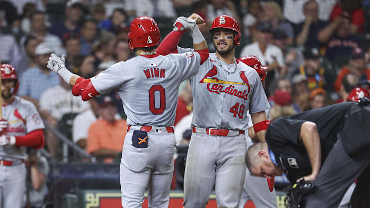 Jun 4, 2024; Houston, Texas, USA; St. Louis Cardinals shortstop Masyn Winn (0) celebrates with catcher Ivan Herrera (48) after hitting a home run during the sixth inning against the Houston Astros at Minute Maid Park. Mandatory Credit: Troy Taormina-Imagn Images