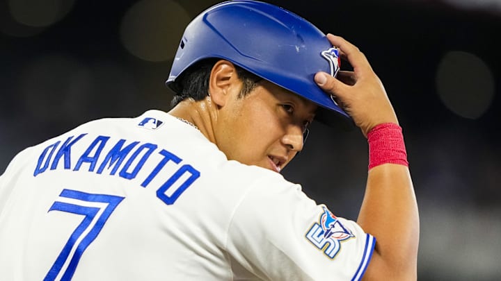 Toronto Blue Jays Kazuma Okamoto (7) tips his helmet after taking a walk against the Colorado Rockies during the fifth inning at Rogers Centre. 