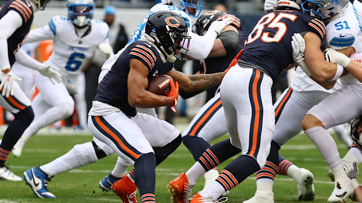 Dec 22, 2024; Chicago, Illinois, USA; Chicago Bears wide receiver DJ Moore (2) rushes the ball against the Detroit Lions during the first quarter at Soldier Field. Mandatory Credit: Mike Dinovo-Imagn Images