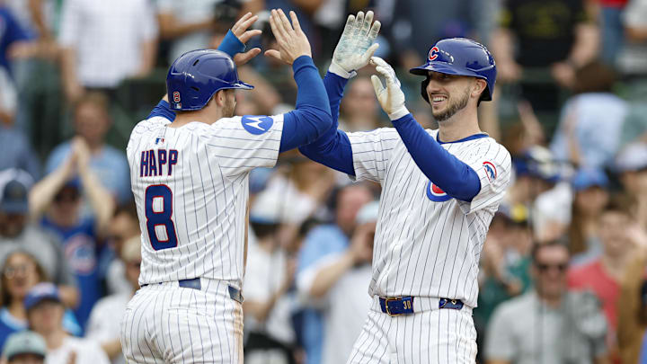 Apr 18, 2025; Chicago, Illinois, USA; Chicago Cubs outfielder Kyle Tucker (30) celebrates with outfielder Ian Happ (8) after hitting a two-run home run against the Arizona Diamondbacks during the eighth inning at Wrigley Field.