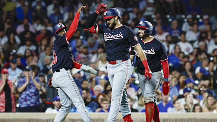 Sep 19, 2024; Chicago, Illinois, USA; Washington Nationals right fielder Joey Gallo (24) celebrates with second baseman Darren Baker (10) and first baseman Juan Yepez (18) after hitting a three-run home run against the Chicago Cubs during the sixth inning at Wrigley Field.