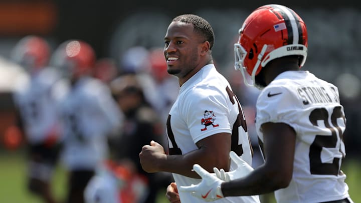 Browns running backs Nick Chubb (left) and Pierre Strong Jr. jog the field during minicamp, Thursday, June 13, 2024, in Berea.