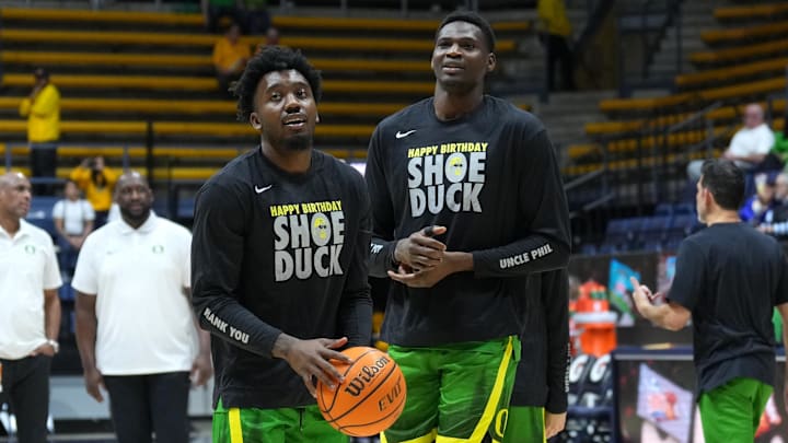 Feb 24, 2024; Berkeley, California, USA; Oregon Ducks guard Jermaine Couisnard (left) and center N'Faly Dante (right)