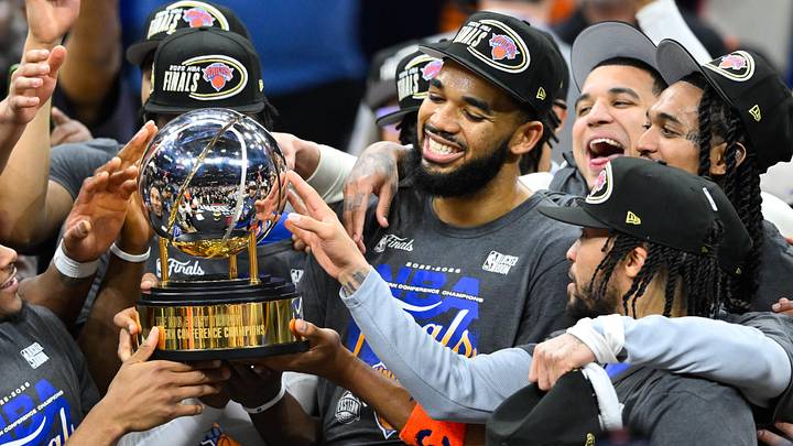 May 25, 2026; Cleveland, Ohio, USA; New York Knicks center Karl-Anthony Towns (32) lifts the 2026 Eastern Conference trophy after defeating the Cleveland Cavaliers in game four of the eastern conference finals for the 2026 NBA playoffs at Rocket Arena.