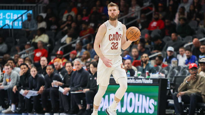 Mar 6, 2024; Atlanta, Georgia, USA; Cleveland Cavaliers forward Dean Wade (32) dribbles against the Atlanta Hawks in the first quarter at State Farm Arena. Mandatory Credit: Brett Davis-Imagn Images
