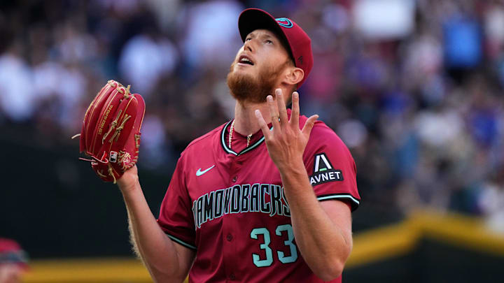 Arizona Diamondbacks left-hander A.J. Puk (33) reacts after closing out their 10-6 win against the Chicago Cubs at Chase Field in Phoenix on Sunday, March 30, 2025.