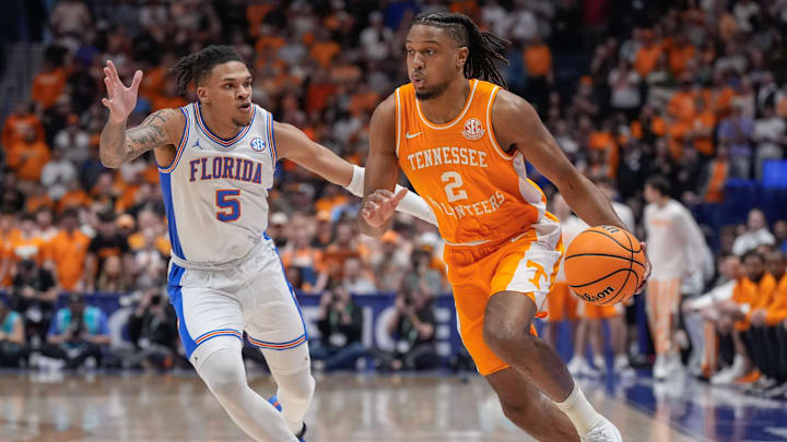 Tennessee guard Chaz Lanier (2) drives up court past Florida guard Will Richard (5) during the first half of the Southeastern Conference tournament championship at Bridgestone Arena in Nashville, Tenn., Sunday, March 16, 2025.